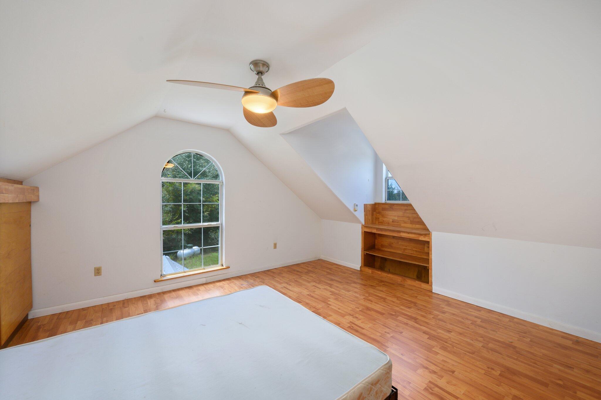 1361 Long Road DeFuniak Springs, FL 32433 - Photo 18 of 43 an empty room with windows and ceiling fan