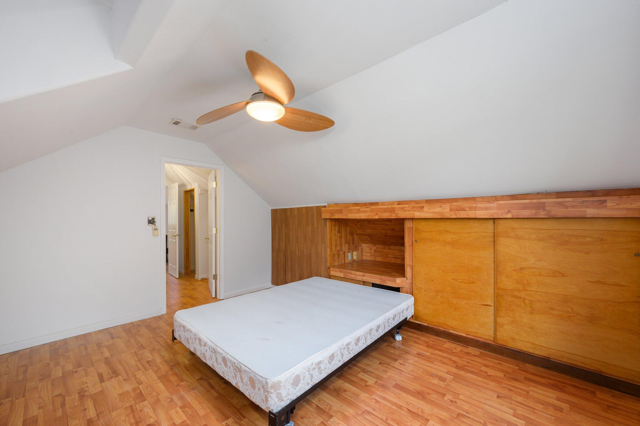 1361 Long Road DeFuniak Springs, FL 32433 - Photo 19 of 43 a bedroom with a bed and a lamp on the table