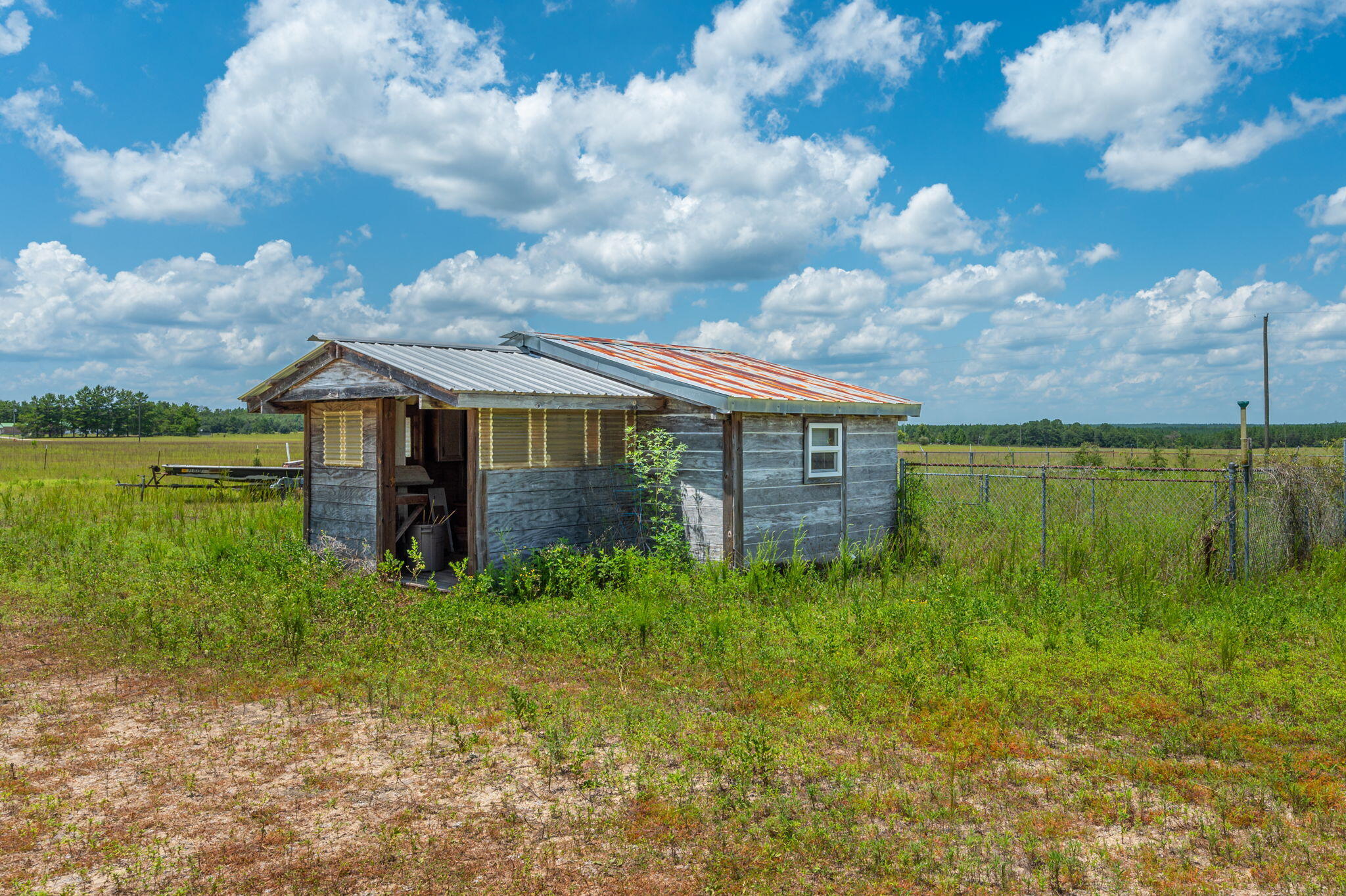1361 Long Road DeFuniak Springs, FL 32433 - Photo 24 of 43 a backyard of a house with lots of green space