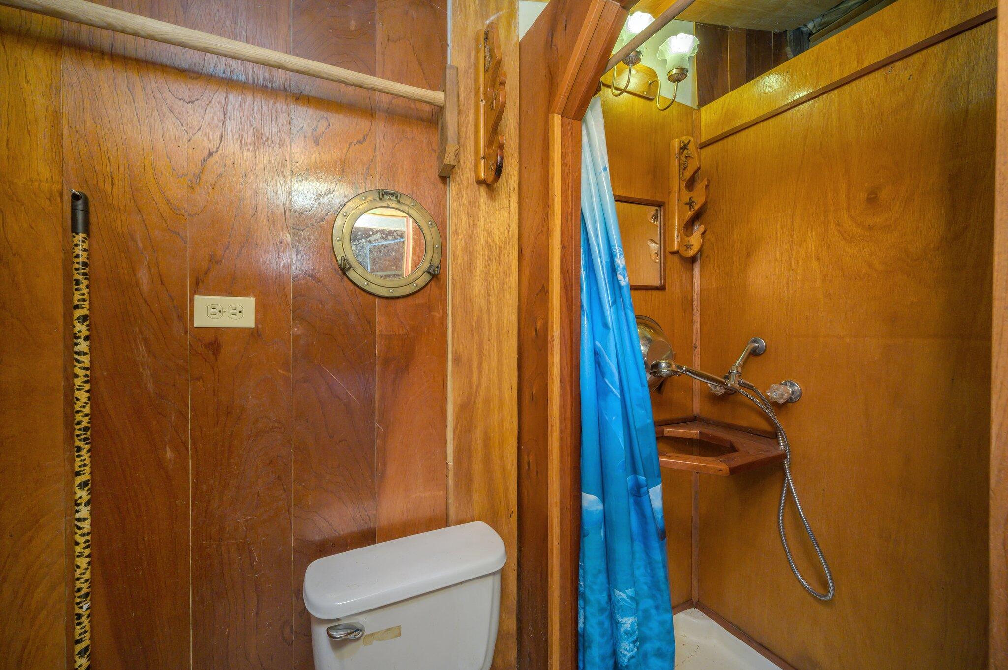 1361 Long Road DeFuniak Springs, FL 32433 - Photo 26 of 43 a bathroom with a shower a toilet and sink