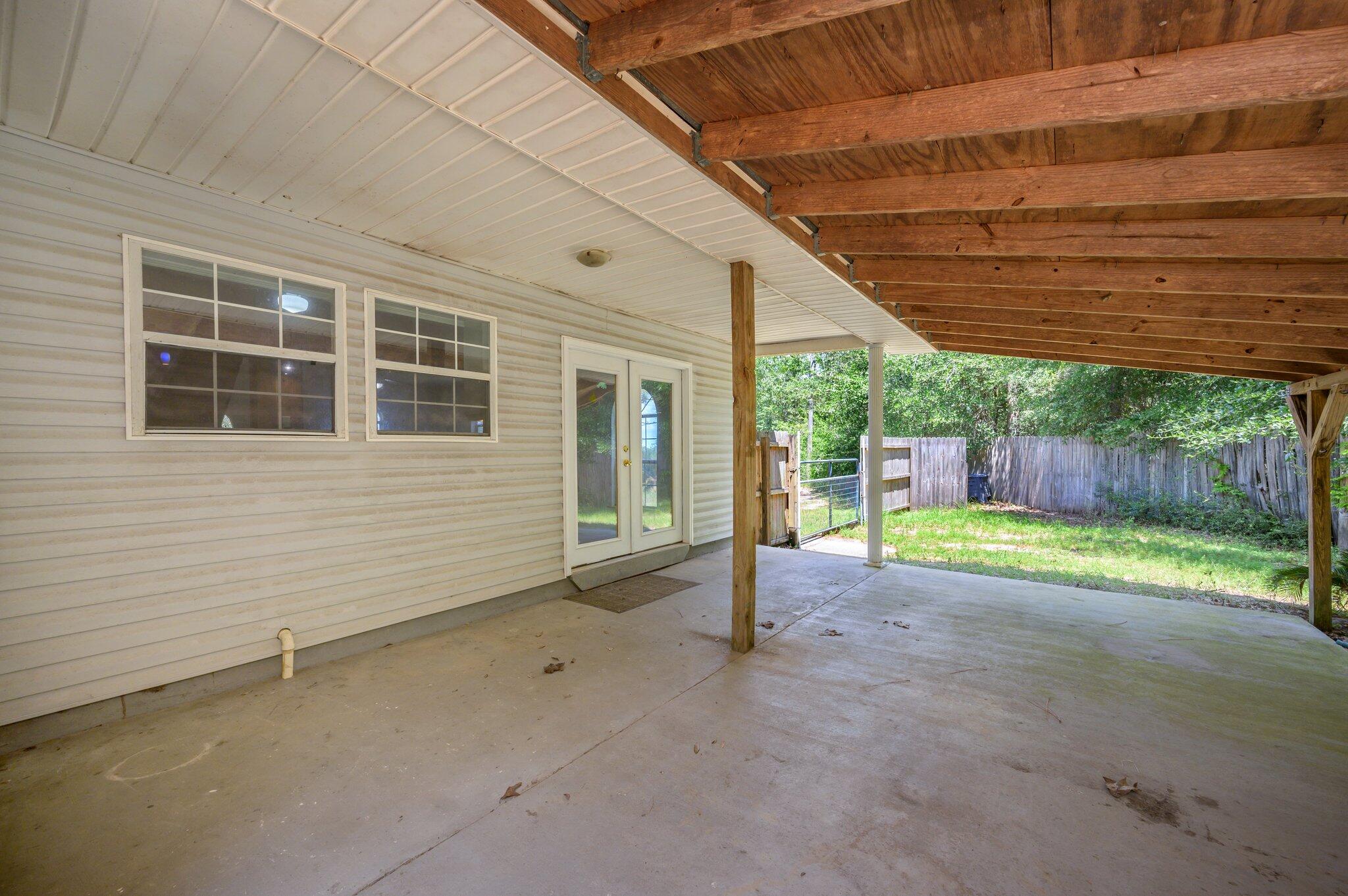 1361 Long Road DeFuniak Springs, FL 32433 - Photo 34 of 43 a view of a house with backyard and porch