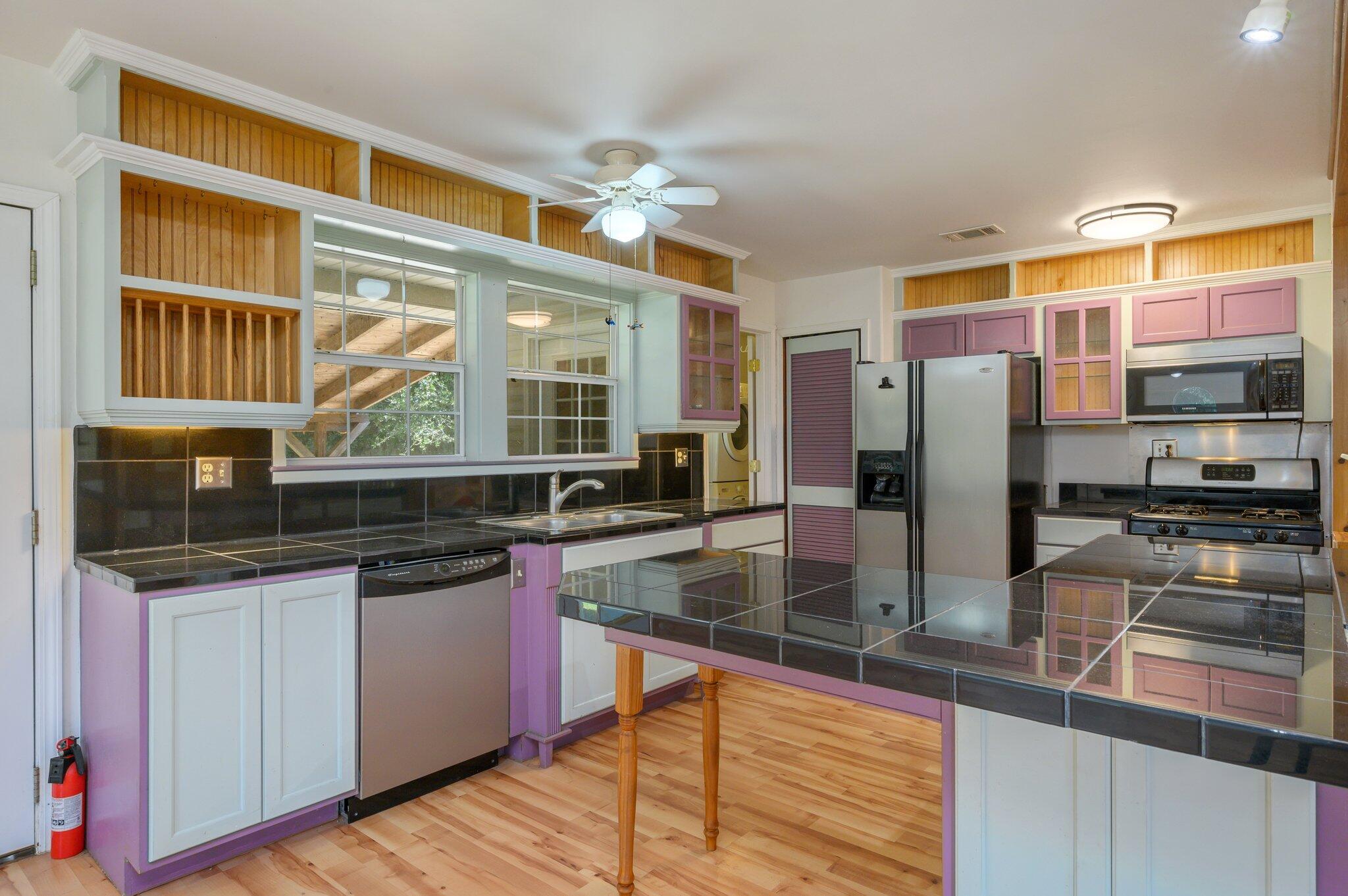 1361 Long Road DeFuniak Springs, FL 32433 - Photo 7 of 43 a kitchen with stainless steel appliances granite countertop a stove and a sink