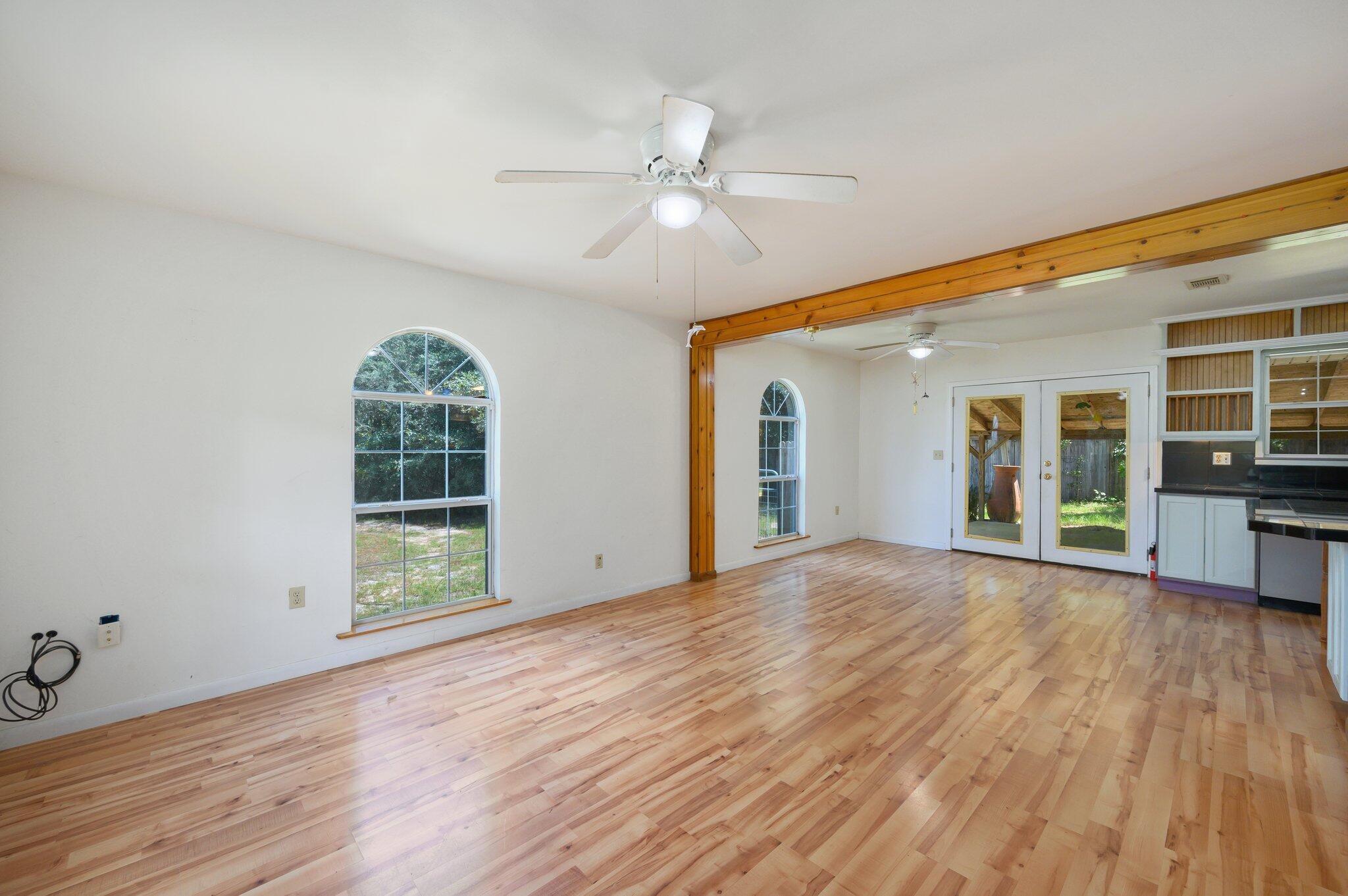 1361 Long Road DeFuniak Springs, FL 32433 - Photo 9 of 43 a view of an empty room with wooden floor and a window