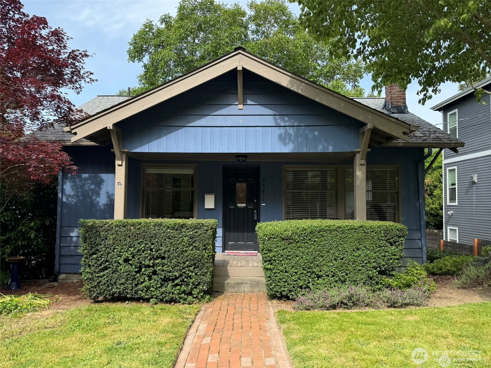 4521 49th Avenue Northeast Seattle, WA 98105 - Photo 1 of 20 a front view of a house with garden