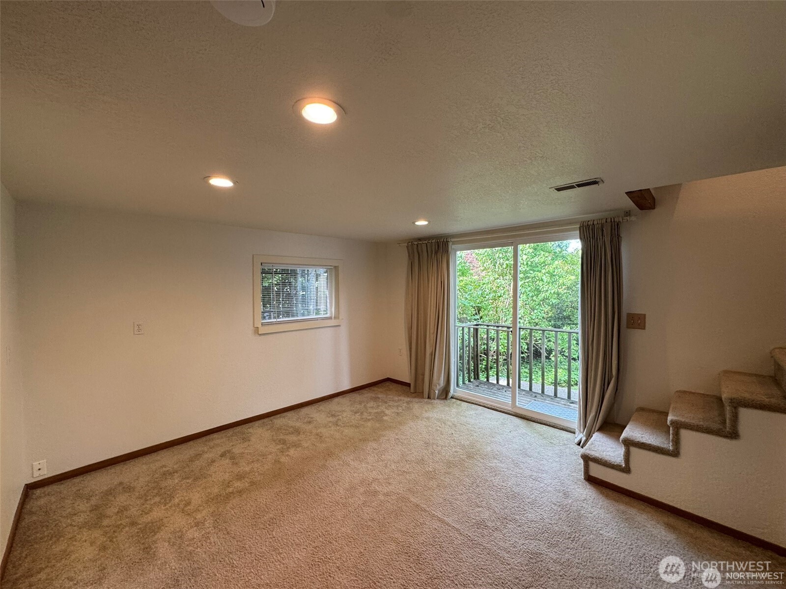 4521 49th Avenue Northeast Seattle, WA 98105 - Photo 13 of 20 a view of an empty room with a window