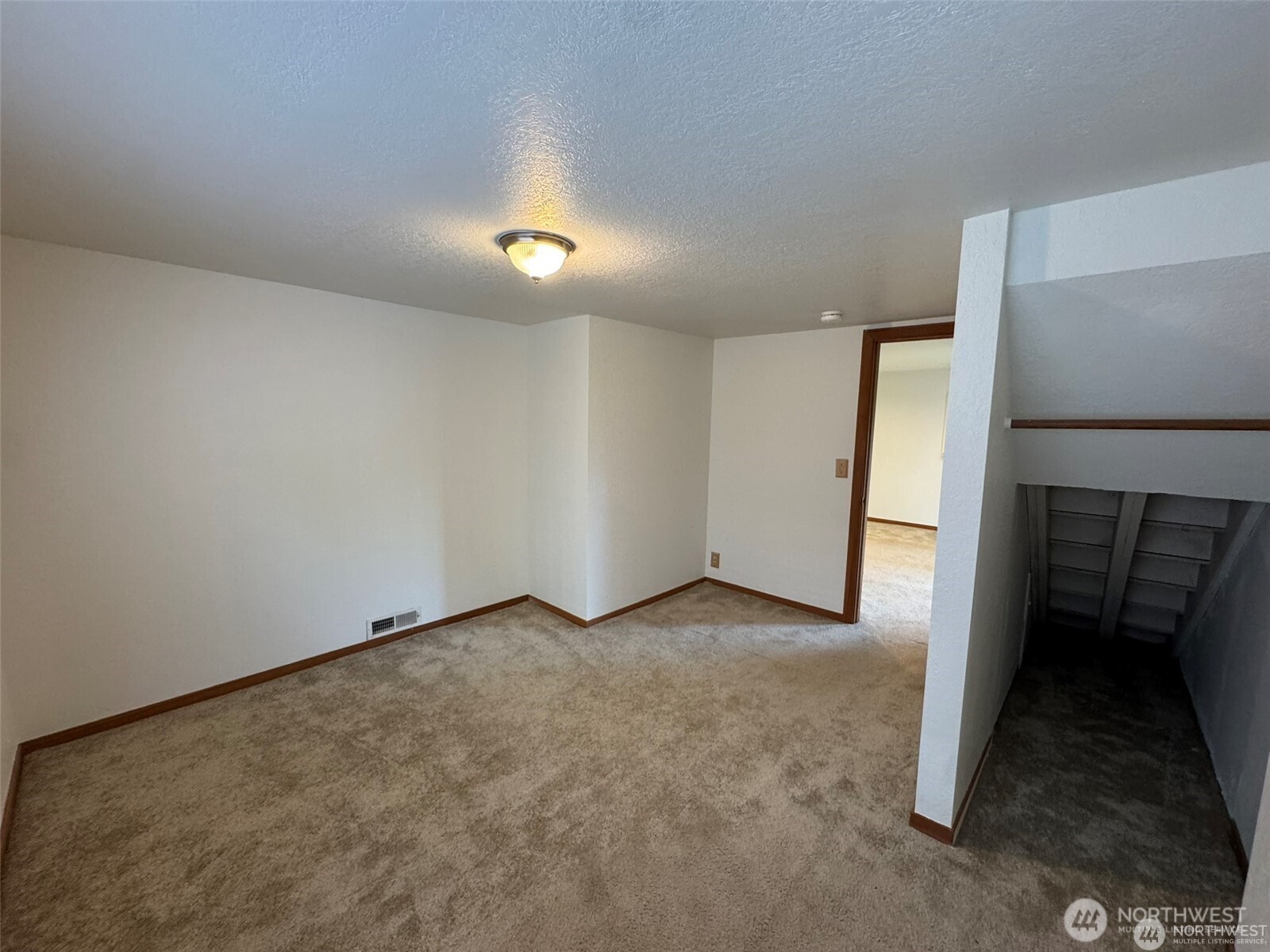 4521 49th Avenue Northeast Seattle, WA 98105 - Photo 16 of 20 an empty room with a bench