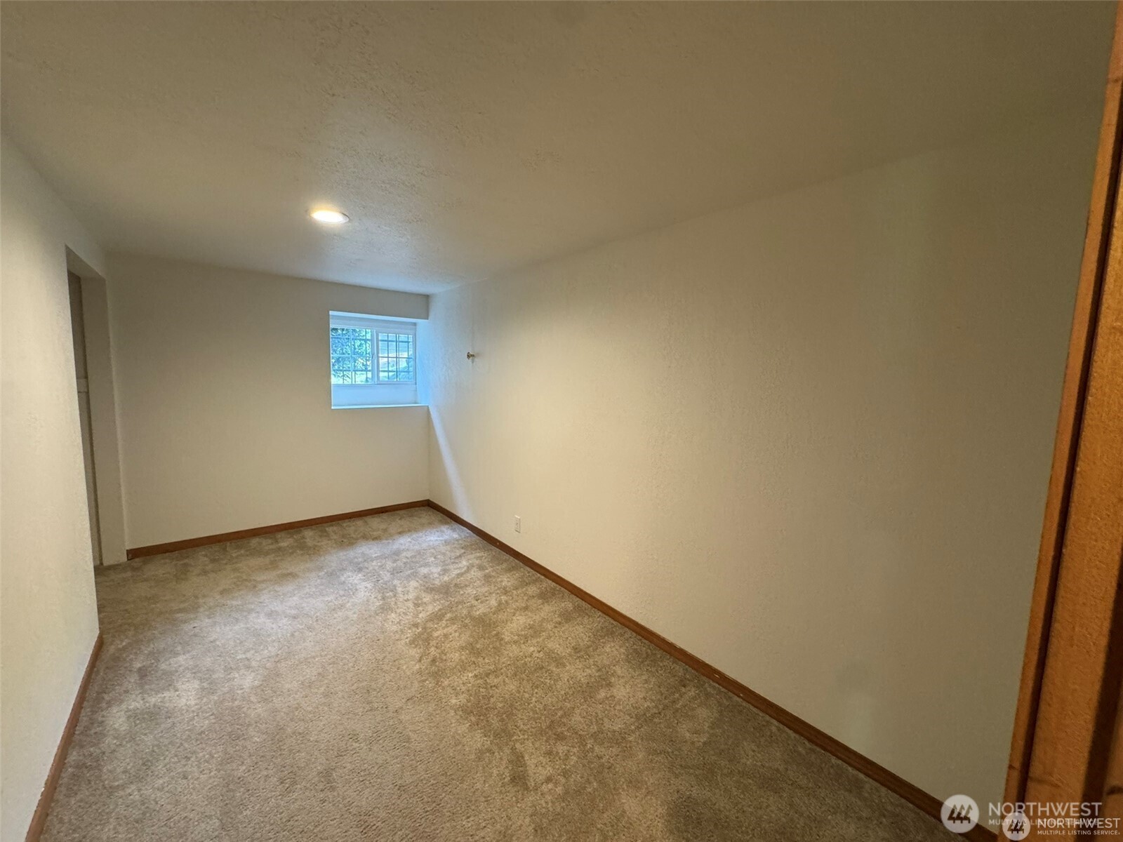 4521 49th Avenue Northeast Seattle, WA 98105 - Photo 17 of 20 a view of an empty room and a window