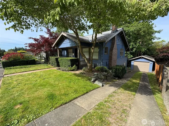 a front view of a house with garden