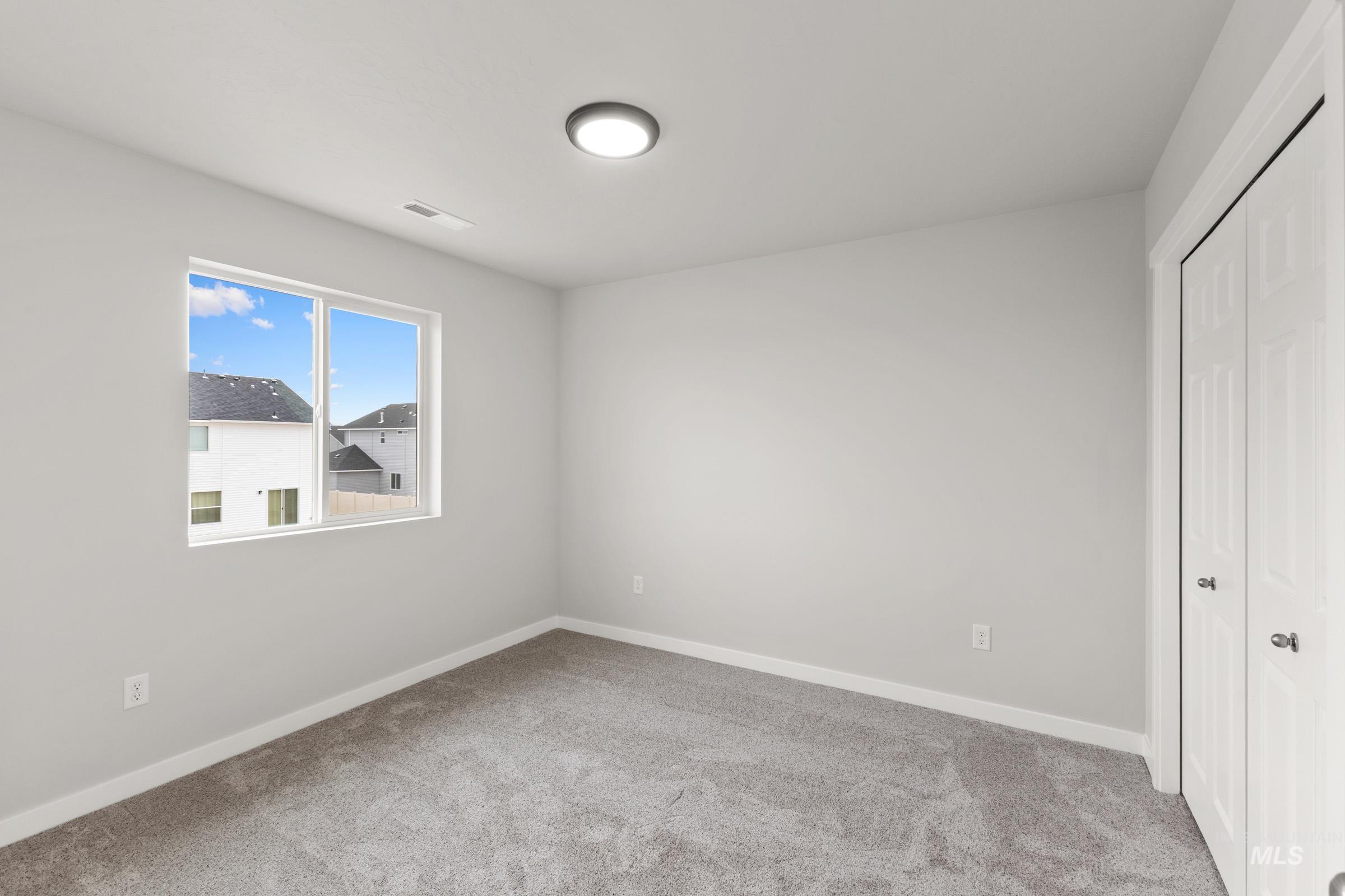 461 Waverly Avenue Middleton, ID 83644 - Photo 12 of 22 Unfurnished bedroom featuring a closet and light carpet