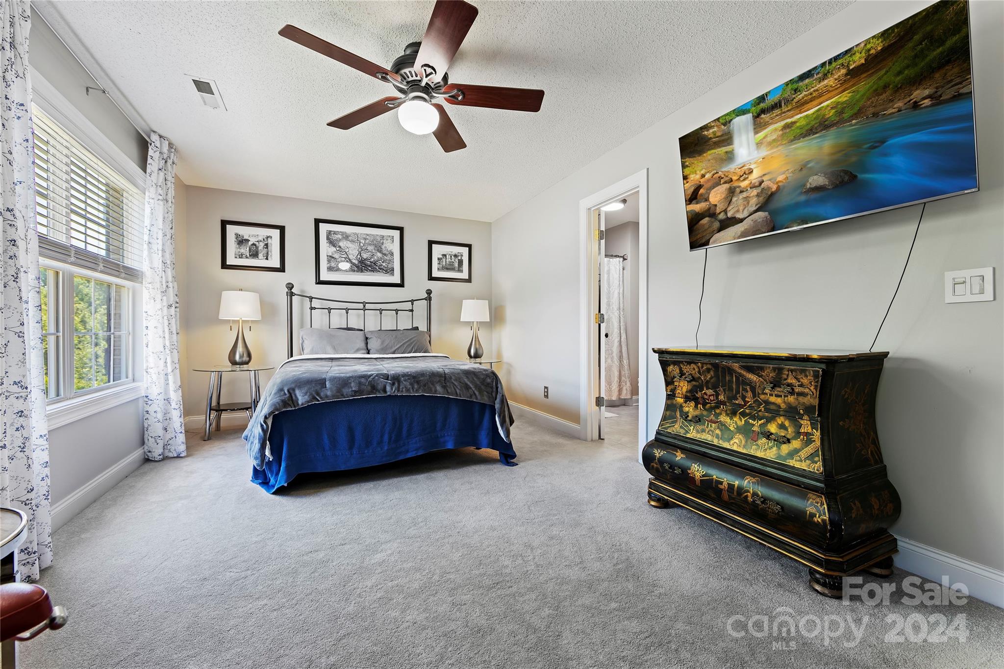 1313 Crown Ridge Drive Fort Mill, SC 29708 - Photo 22 of 35 a bedroom with a bed and a couch