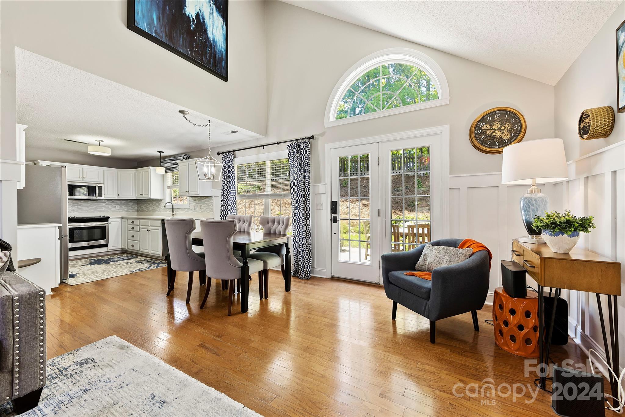1313 Crown Ridge Drive Fort Mill, SC 29708 - Photo 8 of 35 a dining room with wooden floor and large windows