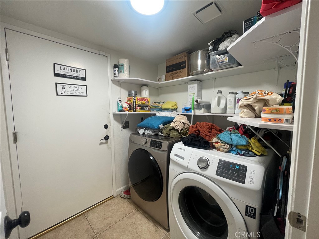 22740 Main Street Grand Terrace, CA 92313 - Photo 14 of 30 a view of storage and utility room with washer and dryer
