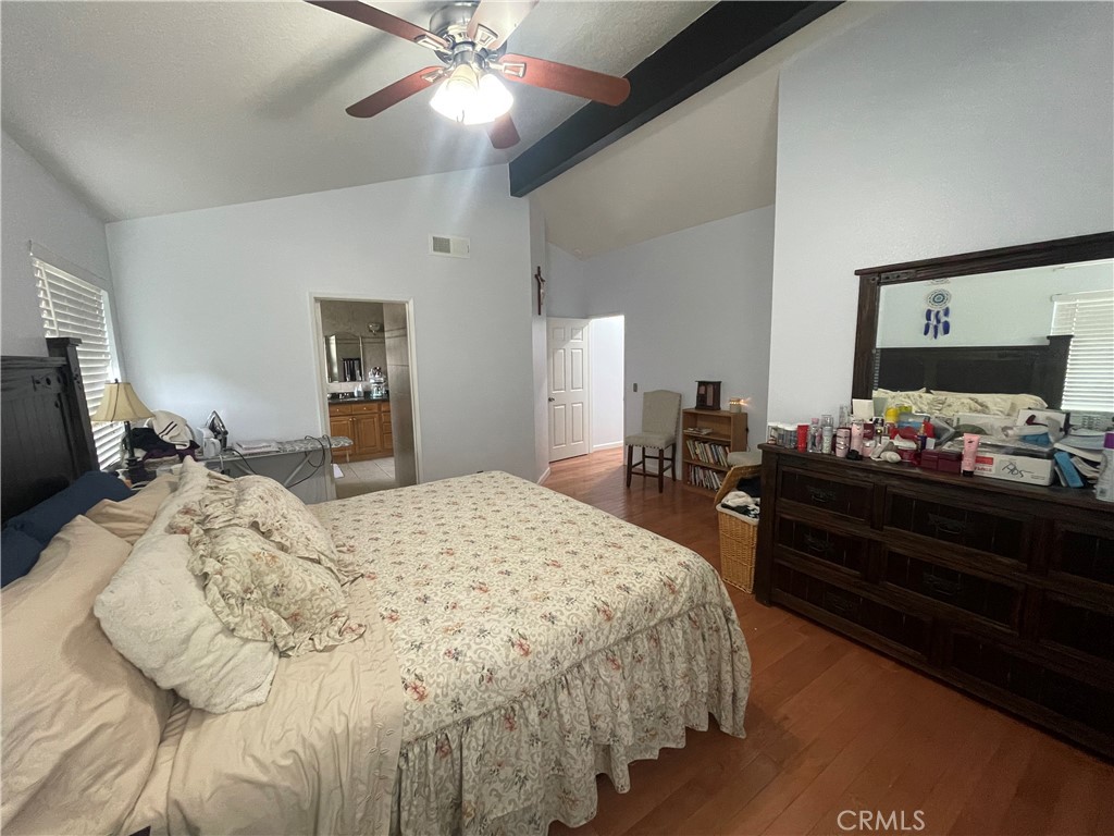 22740 Main Street Grand Terrace, CA 92313 - Photo 18 of 30 a bed room with a bed and a television