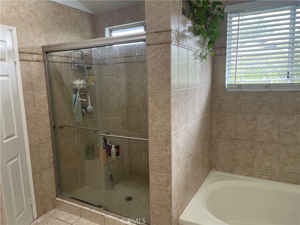 22740 Main Street Grand Terrace, CA 92313 - Photo 19 of 30 a bathroom with a shower
