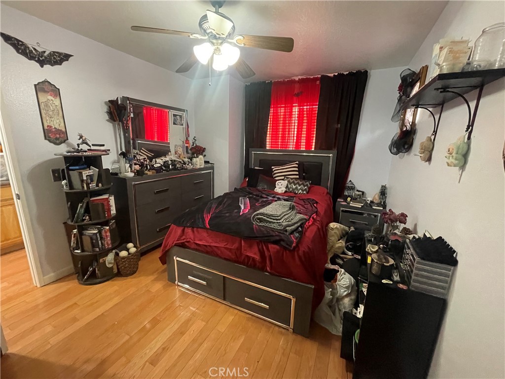 22740 Main Street Grand Terrace, CA 92313 - Photo 22 of 30 a room with a flat screen tv and a window
