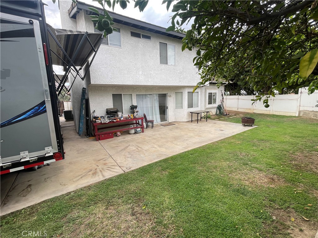 22740 Main Street Grand Terrace, CA 92313 - Photo 27 of 30 a view of a patio with table and chairs and a barbeque