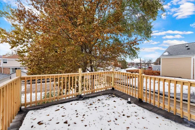 a balcony with wooden fence