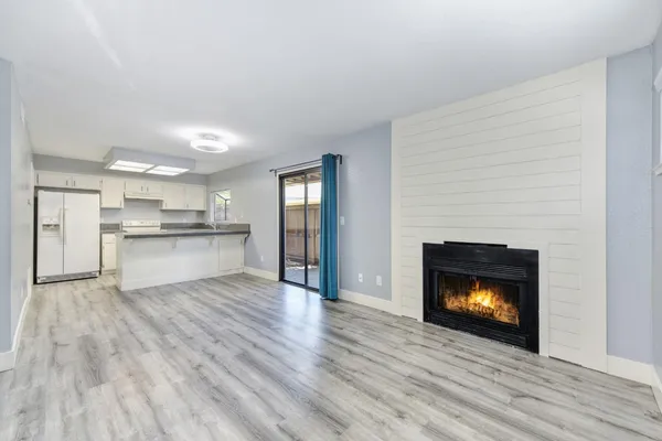 a view of kitchen with wooden floor
