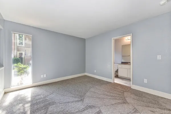 a view of an empty room and window