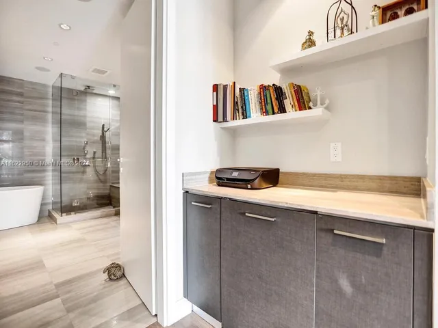 a bedroom with a bed and a night stand