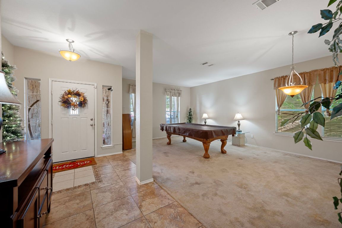17813 Floribundas Lane Elgin, TX 78621 - Photo 4 of 39 a living room with furniture and a table