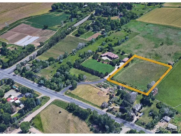 an aerial view of a residential houses with outdoor space