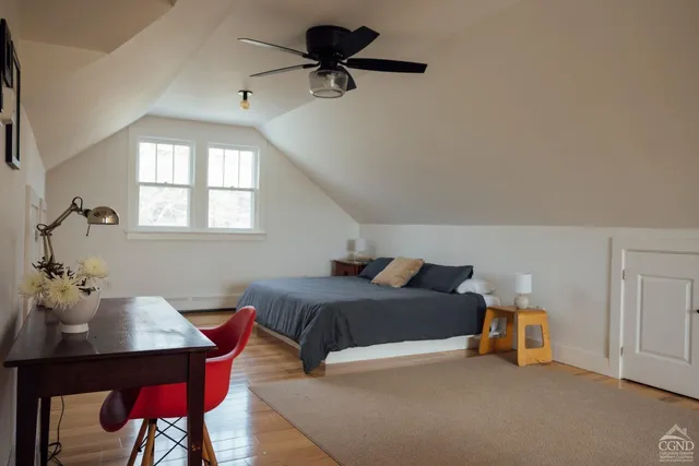 a living room with furniture a window and a table