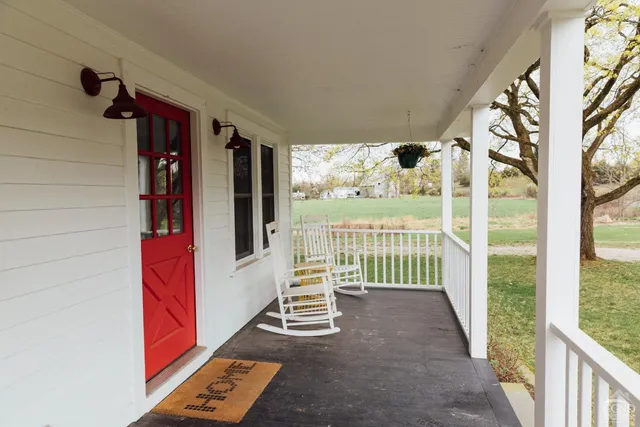 a porch with furniture and window