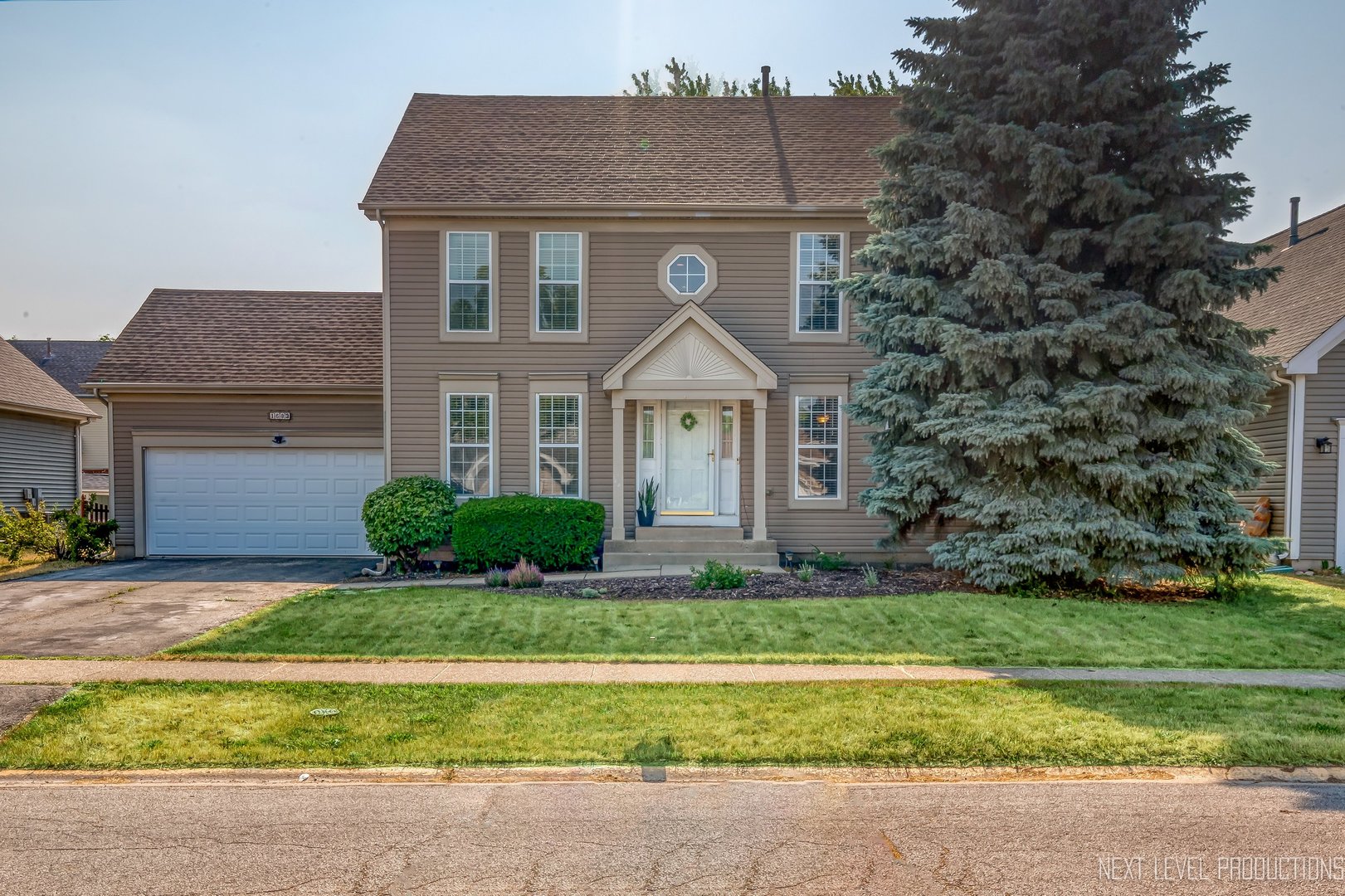 1683 Kautz Road Aurora, IL 60504 - Photo 1 of 26 a front view of a house with a yard