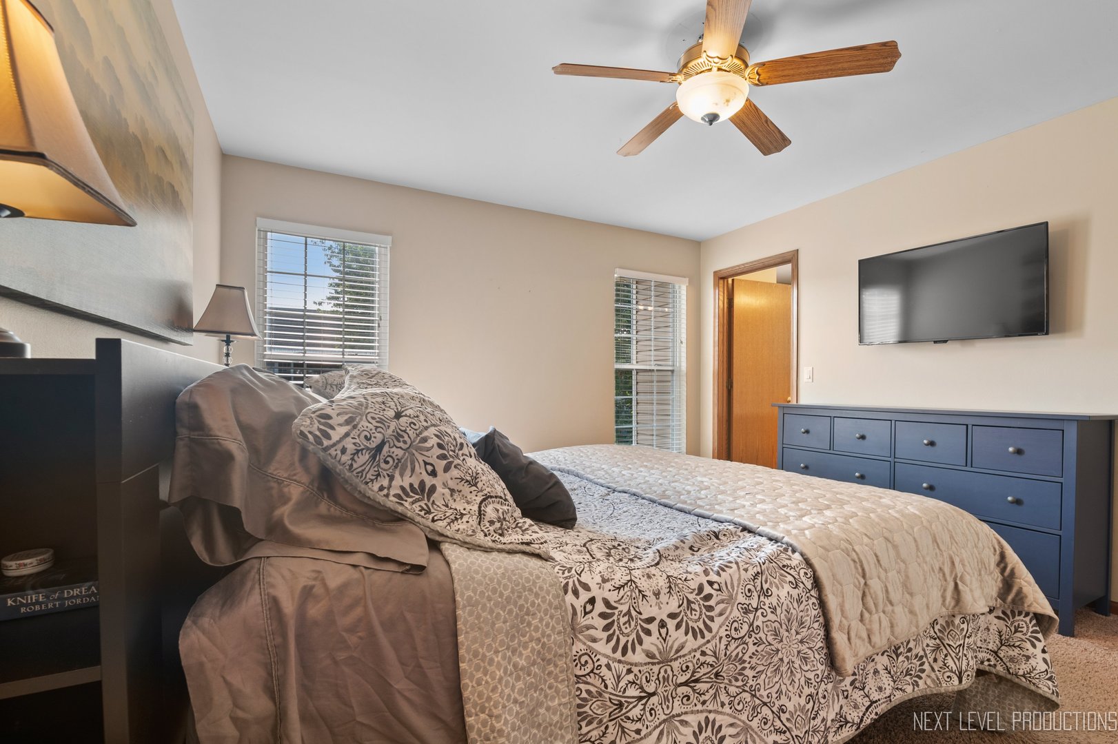 1683 Kautz Road Aurora, IL 60504 - Photo 15 of 26 a bedroom with a bed and a flat screen tv