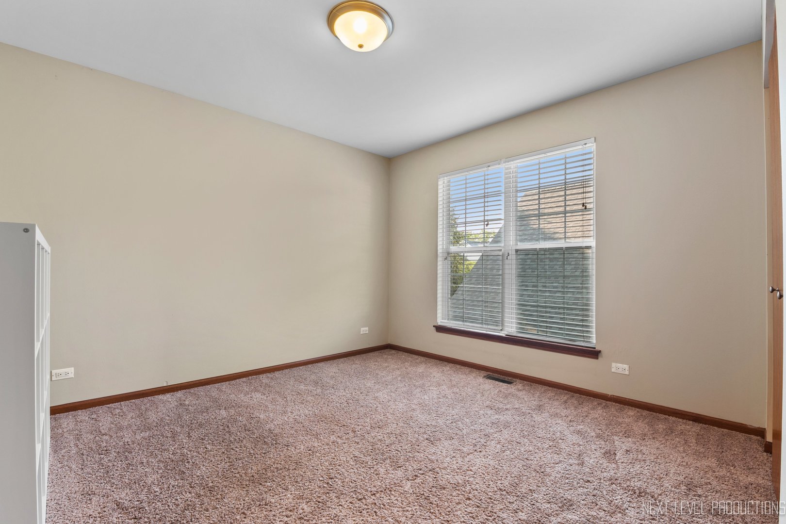 1683 Kautz Road Aurora, IL 60504 - Photo 19 of 26 a view of an empty room with a window