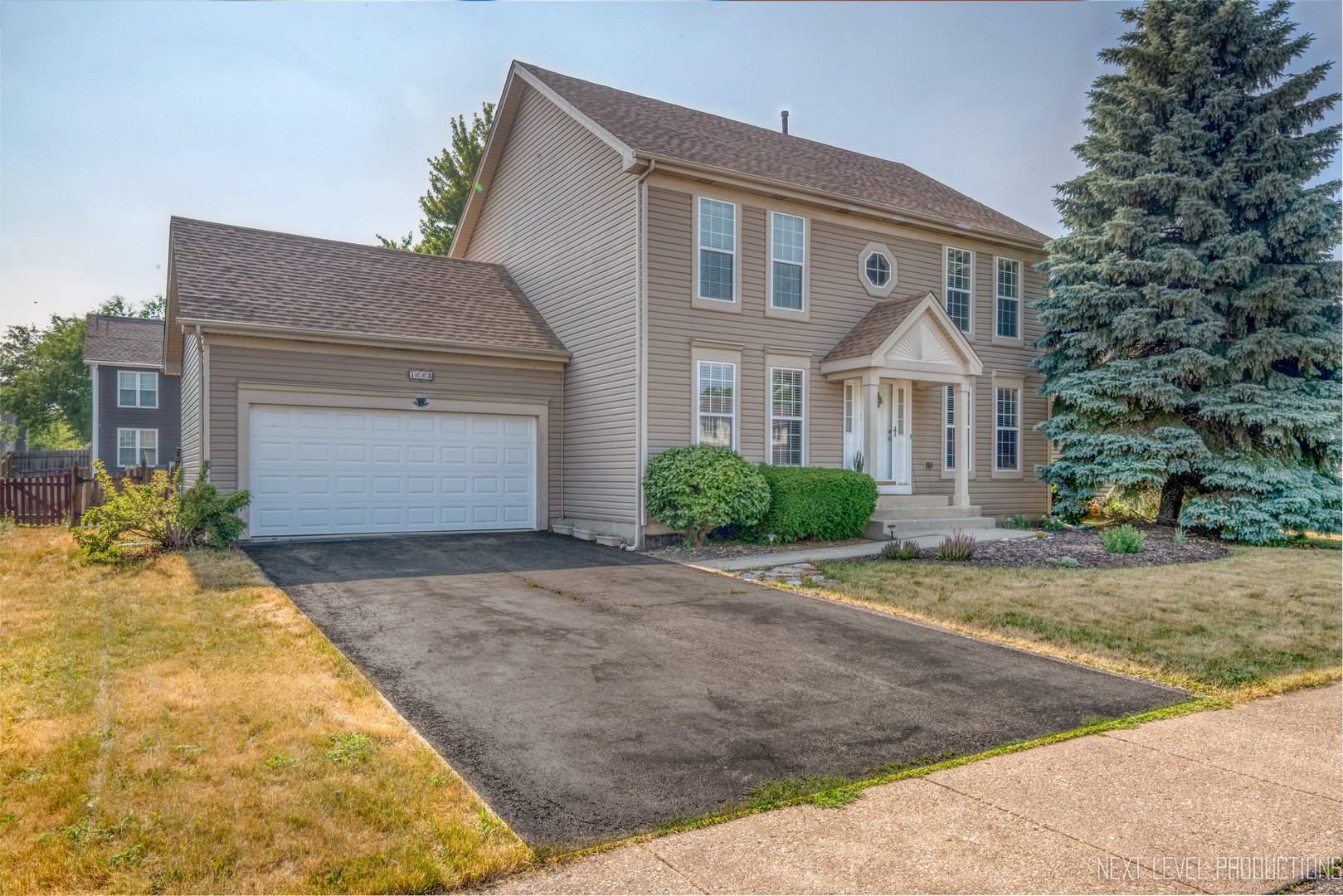 1683 Kautz Road Aurora, IL 60504 - Photo 2 of 26 a front view of a house with garden