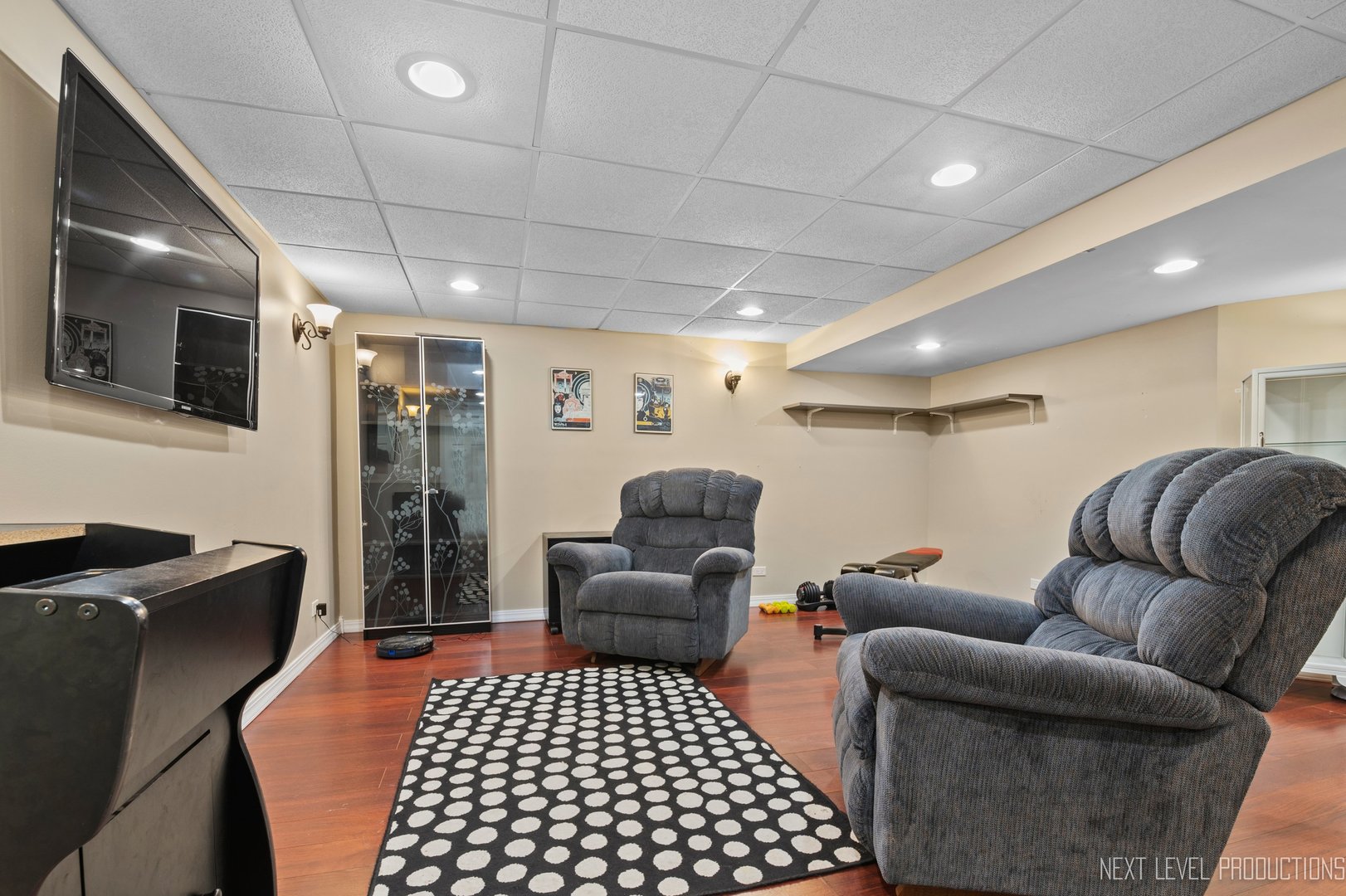 1683 Kautz Road Aurora, IL 60504 - Photo 21 of 26 a living room with furniture a flat screen tv and a refrigerator