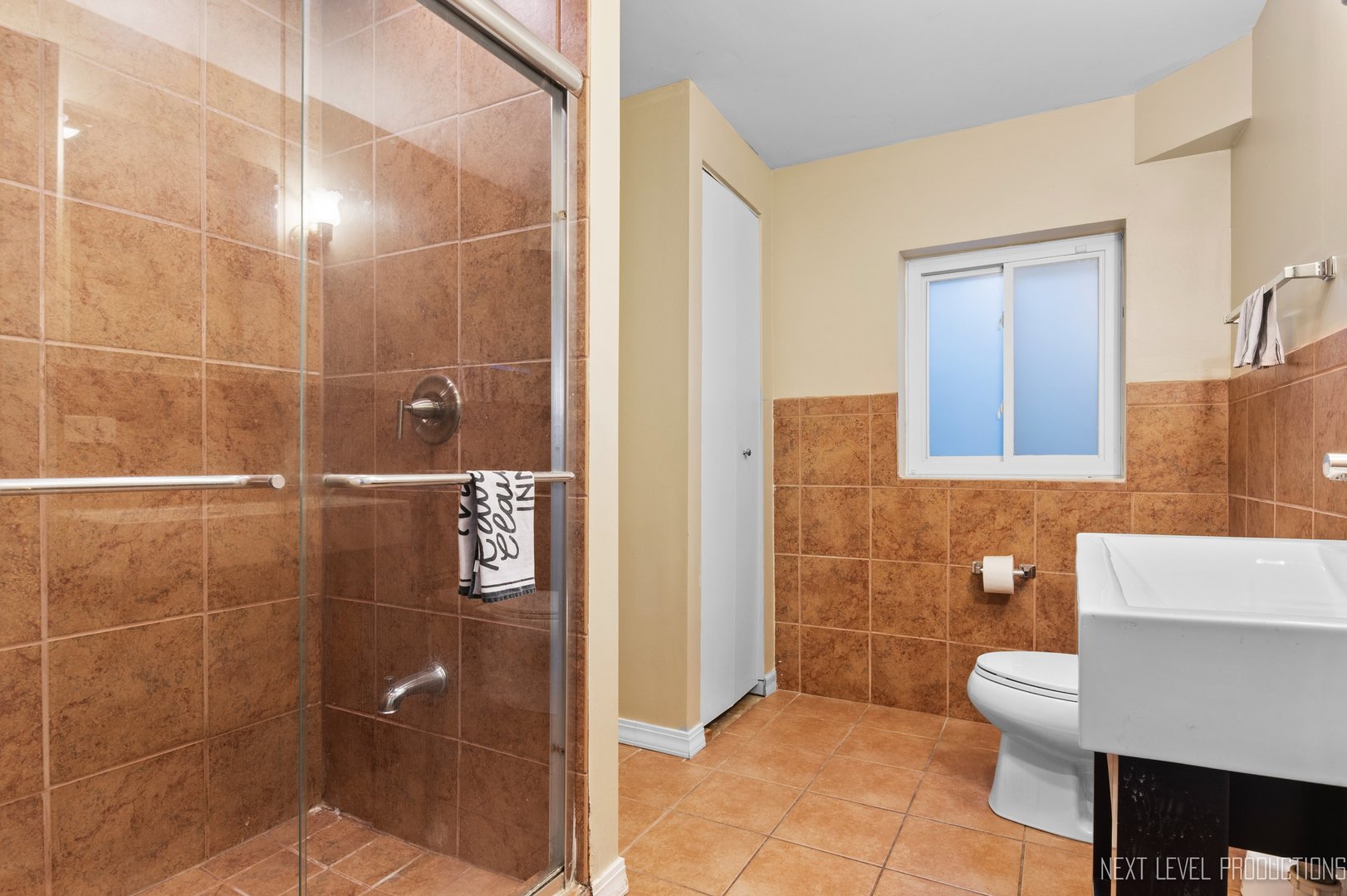 1683 Kautz Road Aurora, IL 60504 - Photo 23 of 26 a bathroom with a toilet and a shower