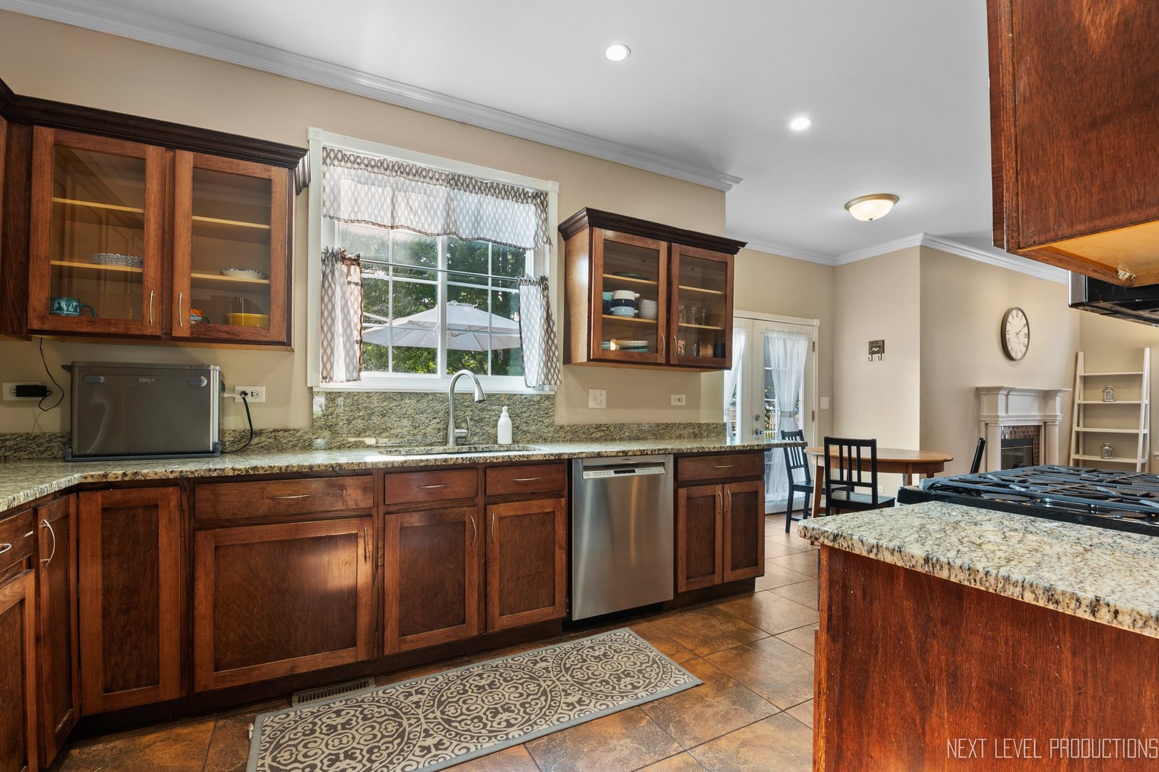 1683 Kautz Road Aurora, IL 60504 - Photo 4 of 26 a large kitchen with granite countertop a sink and a stove
