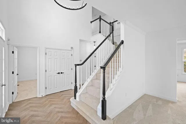 a view of entryway with hall and wooden floor