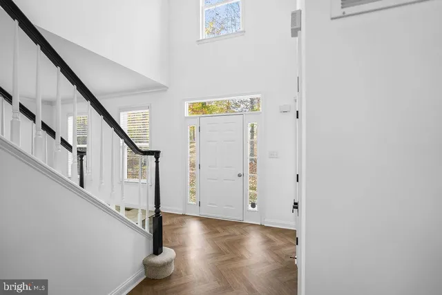a view of entryway with stairs and wooden floor