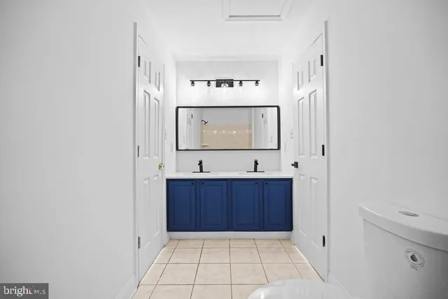 a bathroom with a bathtub and a sink