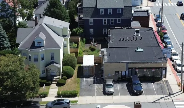 a view of multiple houses with street