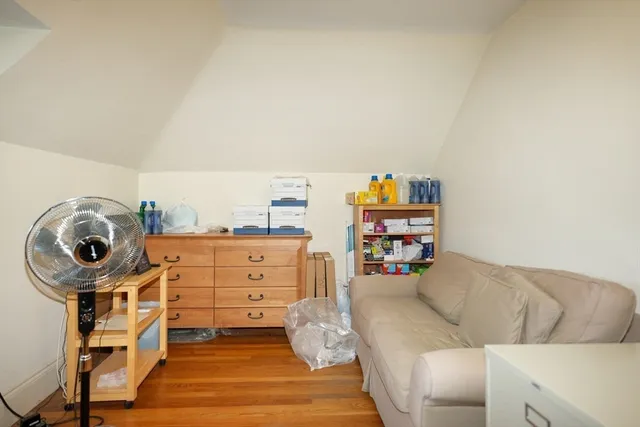 a kitchen with stainless steel appliances granite countertop a stove and a white cabinets