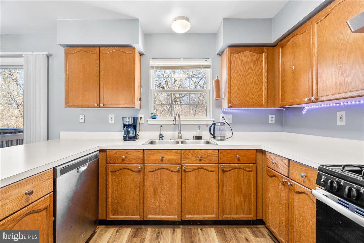 5636 Ashburn Terrace Frederick, MD 21703 - Photo 17 of 44 a kitchen with stainless steel appliances a sink window and cabinets