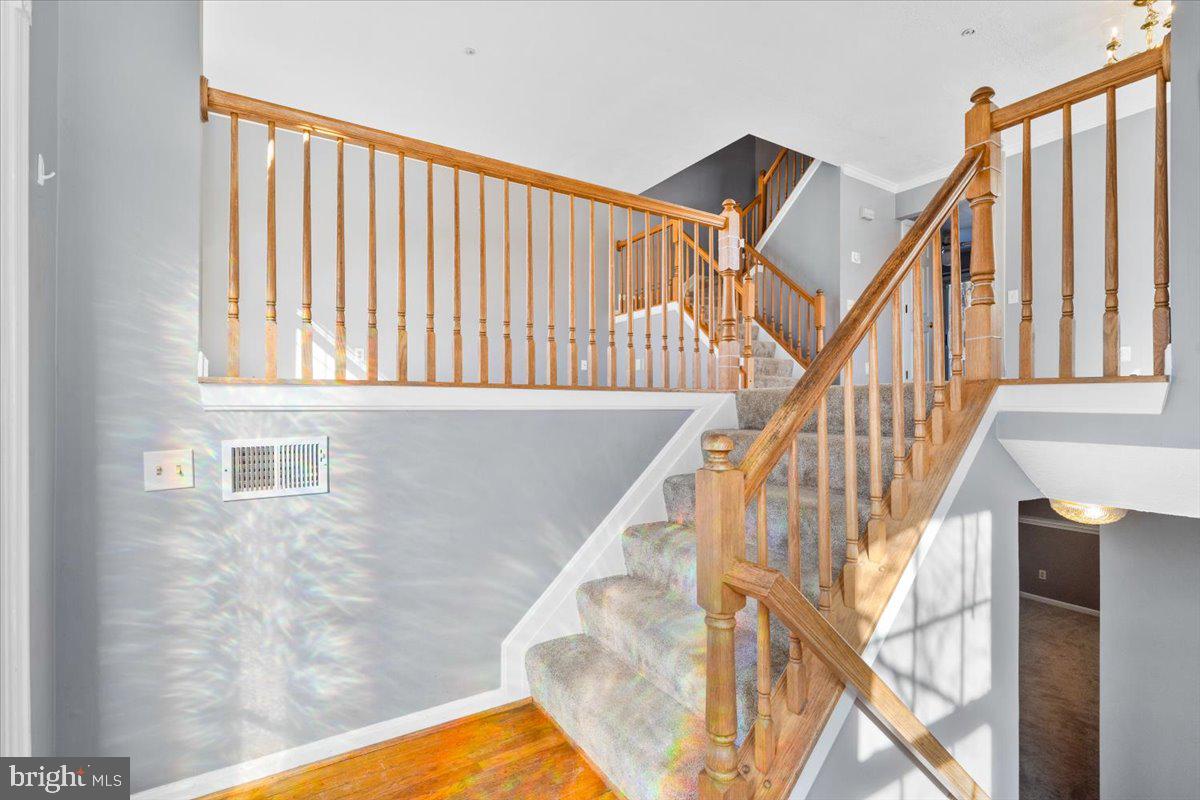 5636 Ashburn Terrace Frederick, MD 21703 - Photo 6 of 44 a view of staircase with railing and white walls