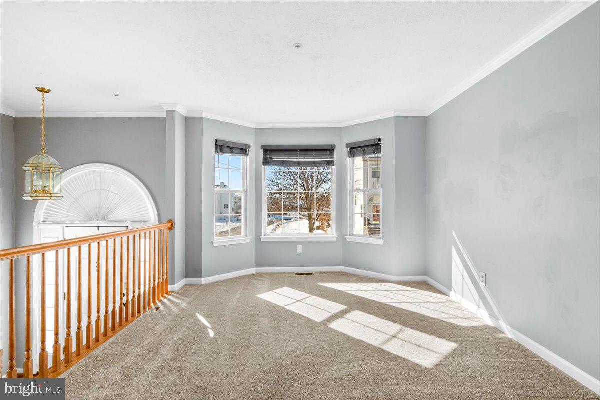 5636 Ashburn Terrace Frederick, MD 21703 - Photo 7 of 44 a view of a room with large windows and a bed