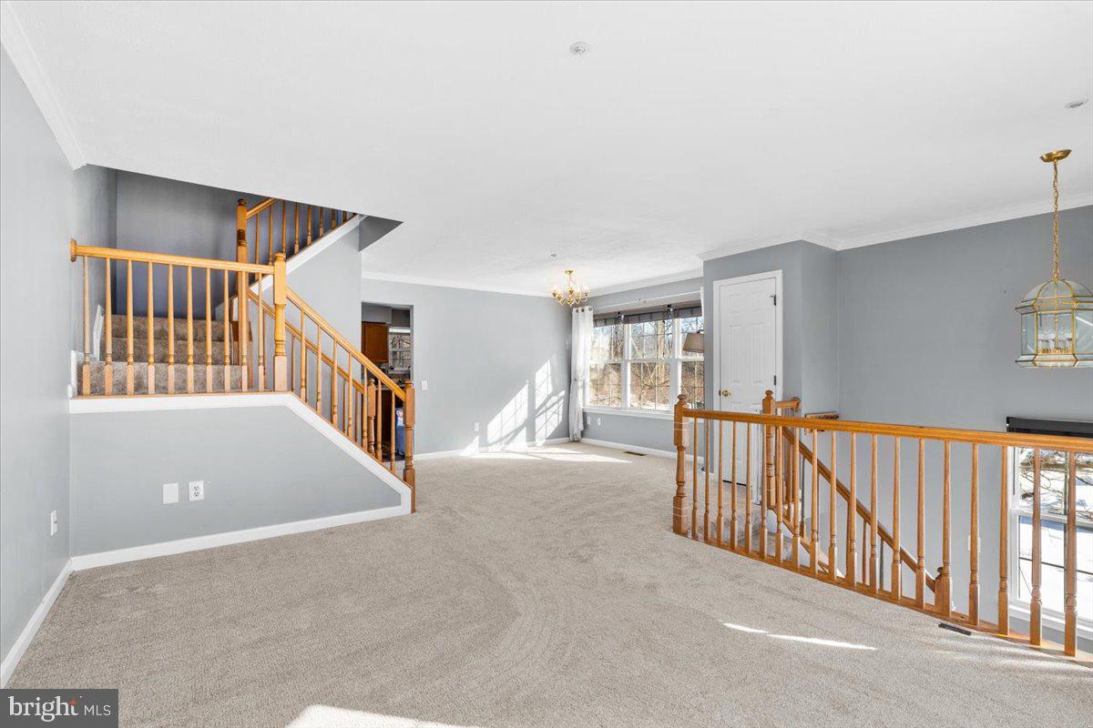 5636 Ashburn Terrace Frederick, MD 21703 - Photo 9 of 44 a view of a hallway with windows