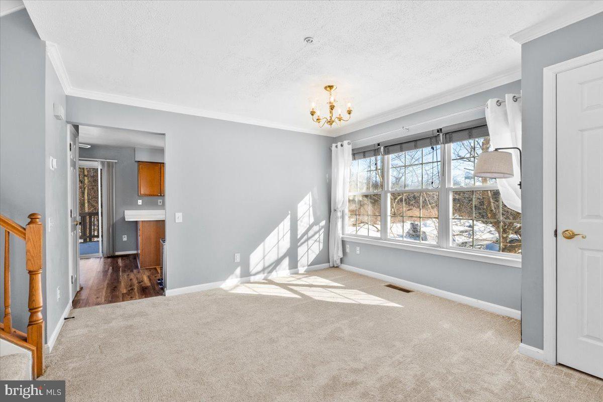 5636 Ashburn Terrace Frederick, MD 21703 - Photo 10 of 44 a view of a livingroom with a window and a chandelier