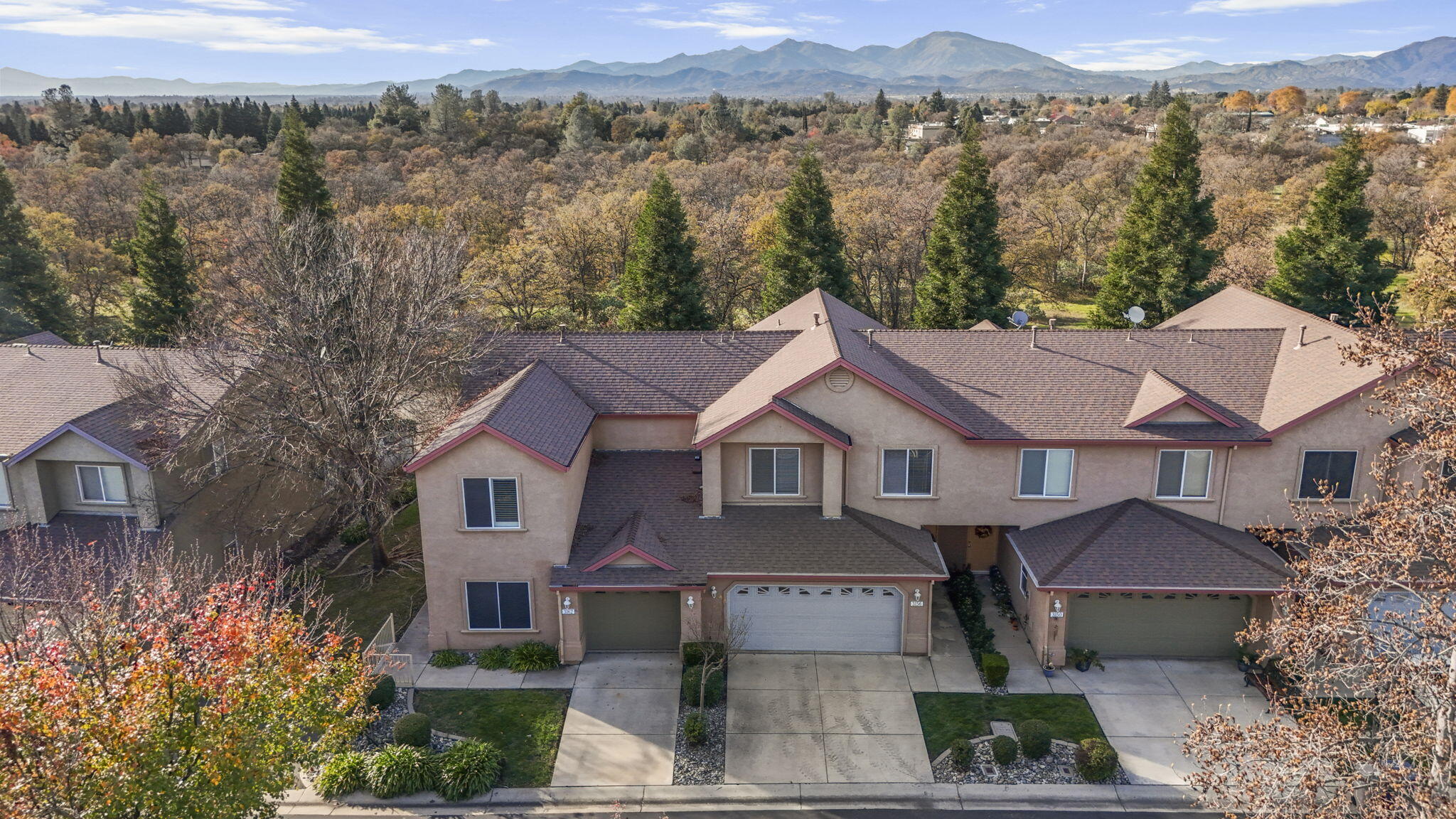 3156 Niklaus Path Redding, CA 96002 - Photo 1 of 34 a front view of a house with a yard and mountain view