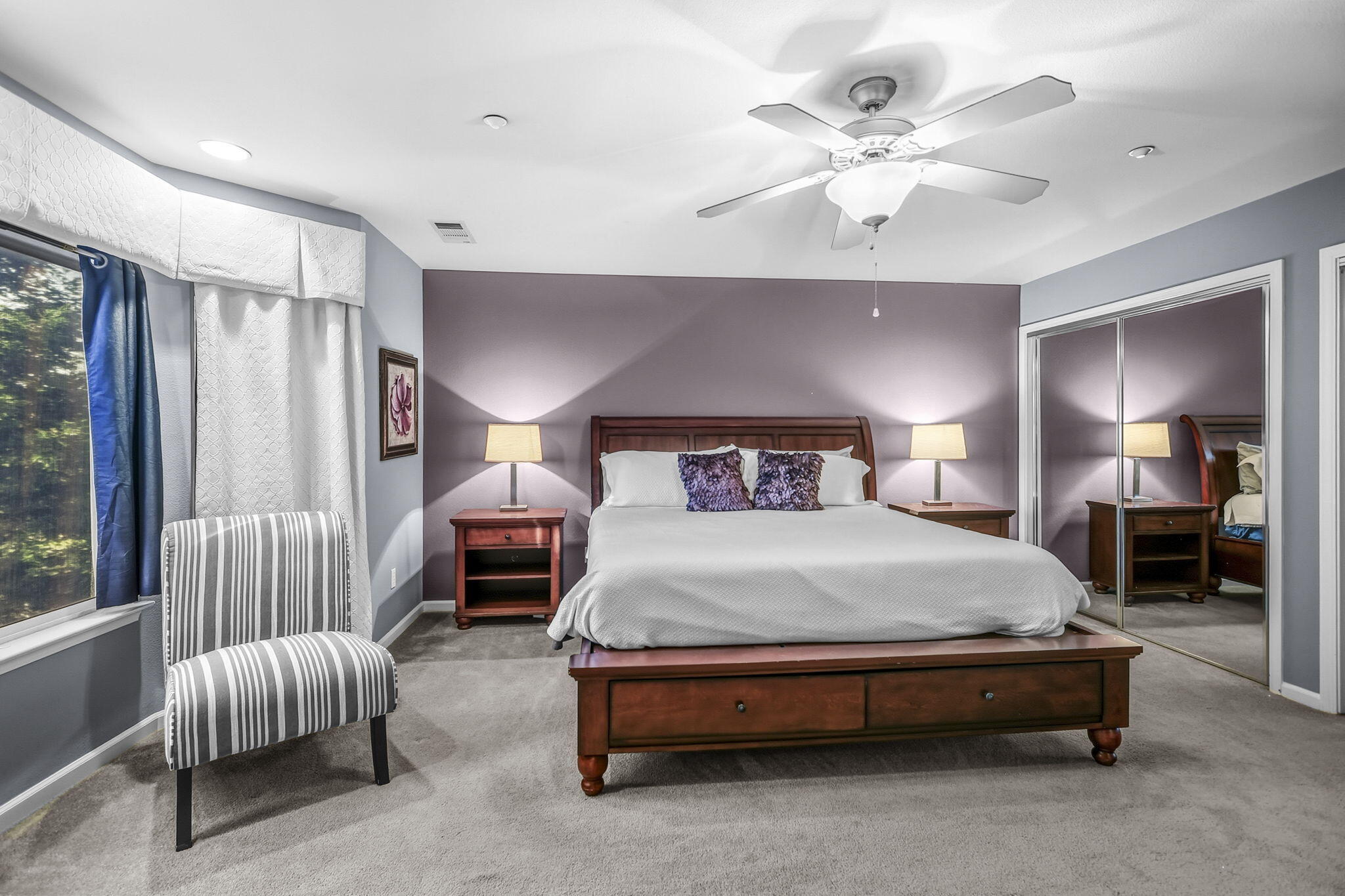 3156 Niklaus Path Redding, CA 96002 - Photo 13 of 34 a spacious bedroom with a bed and a chandelier