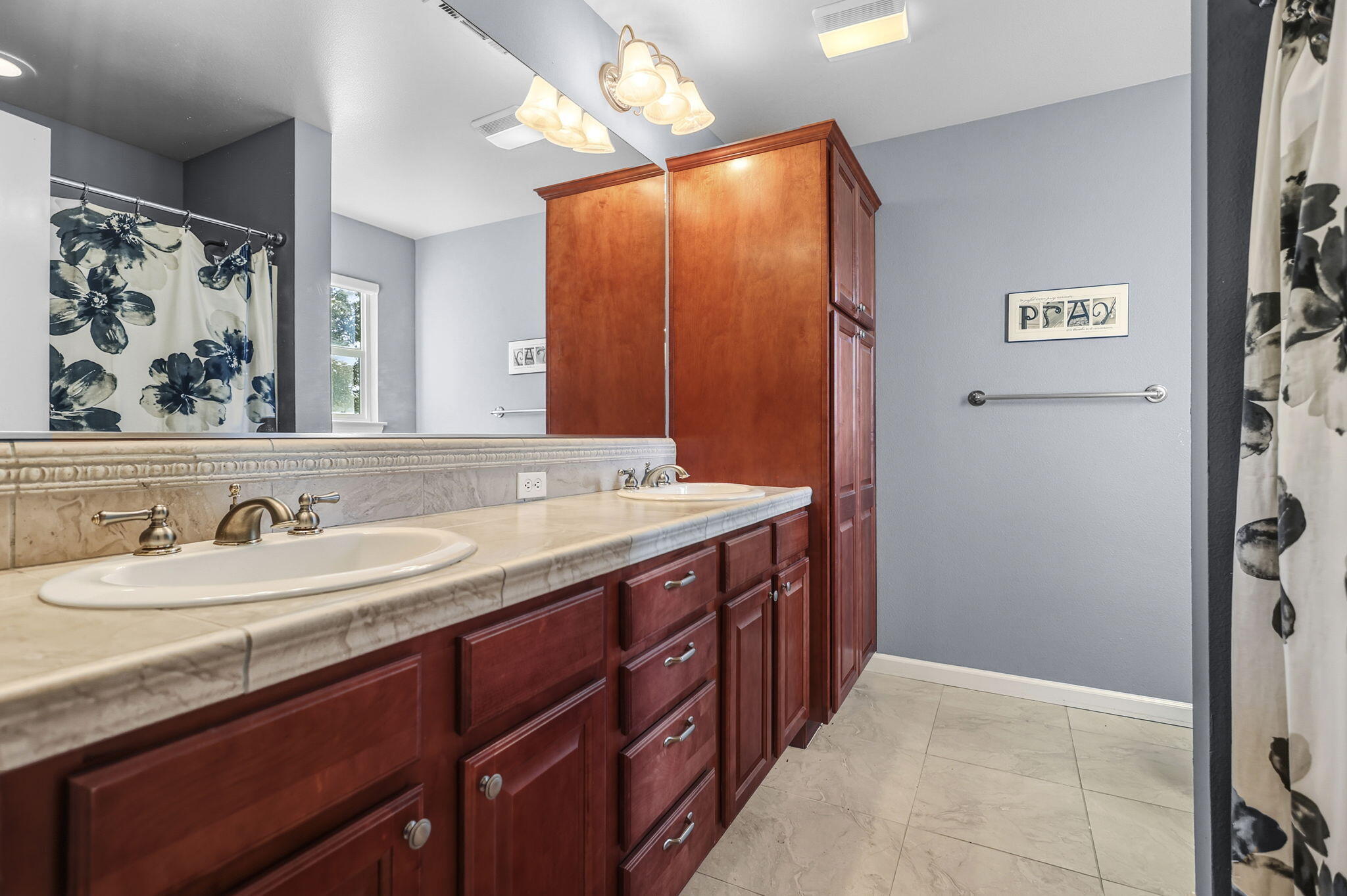 3156 Niklaus Path Redding, CA 96002 - Photo 15 of 34 a bathroom with a sink and a mirror