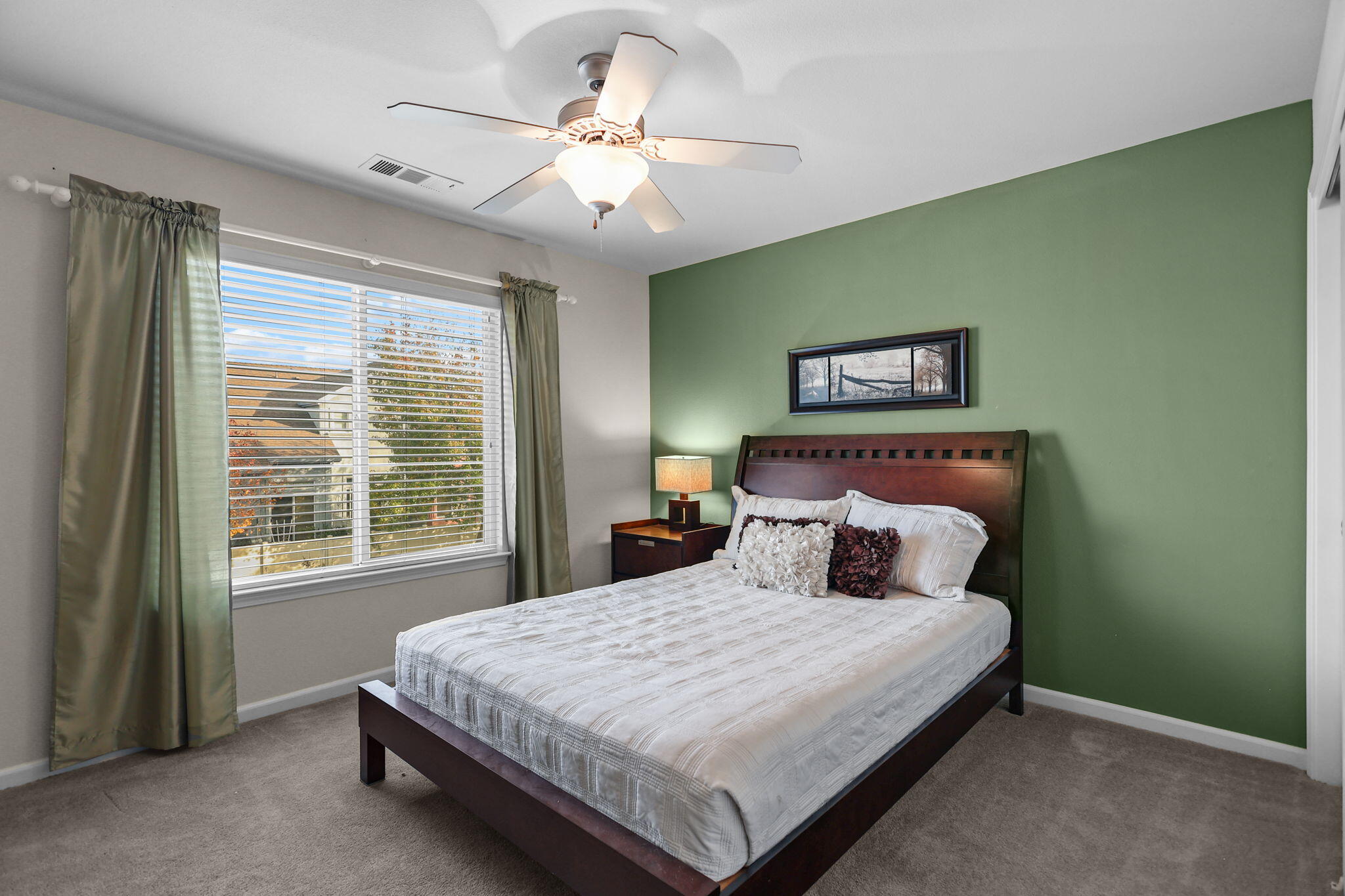 3156 Niklaus Path Redding, CA 96002 - Photo 16 of 34 a bedroom with a large bed and a chandelier