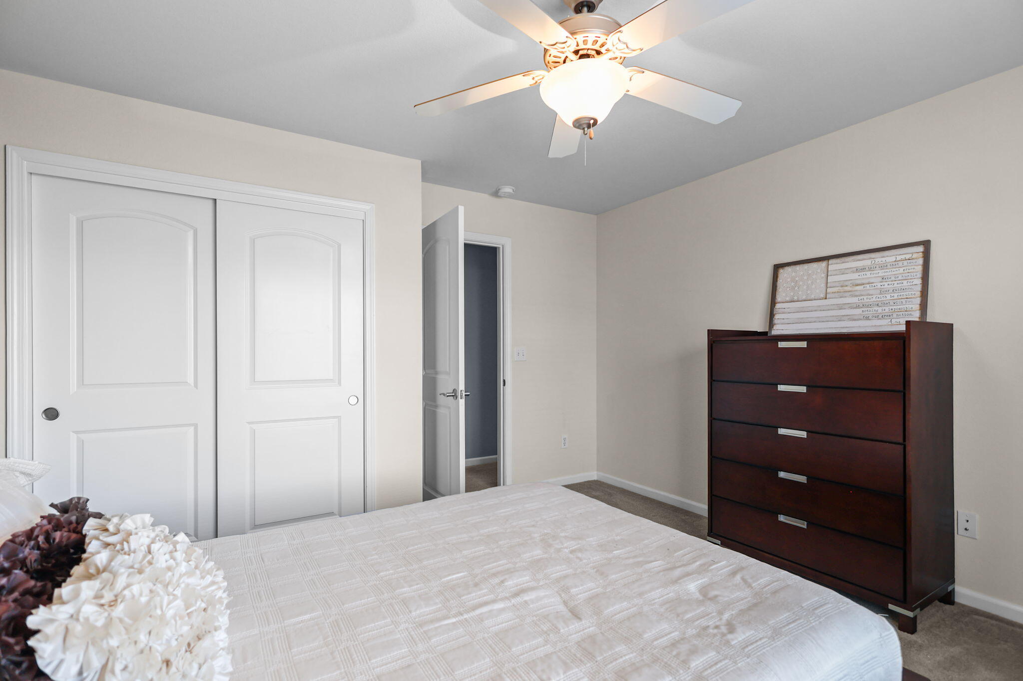 3156 Niklaus Path Redding, CA 96002 - Photo 17 of 34 a bedroom with a bed and a chandelier